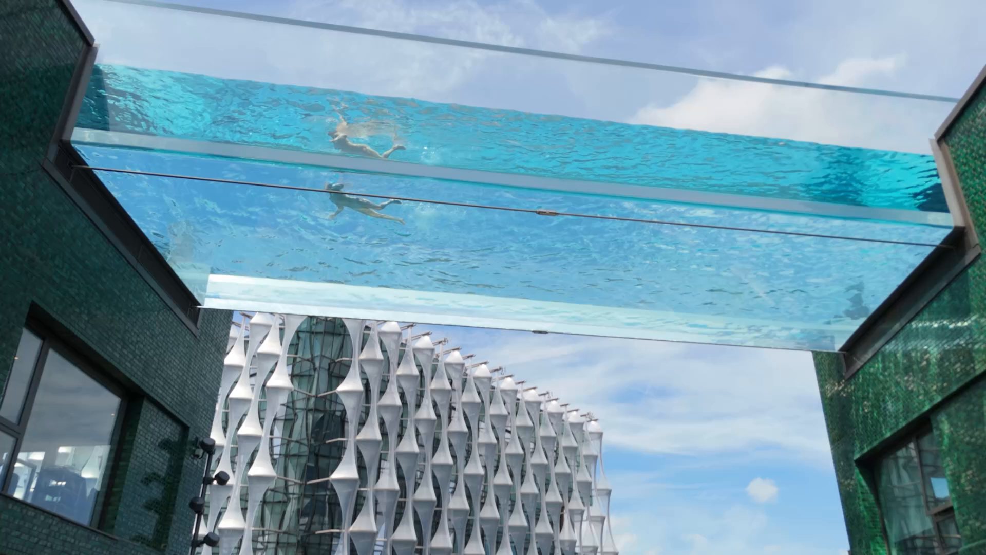 Aerial view of the Embassy Gardens sky pool suspended between two residential towers in London