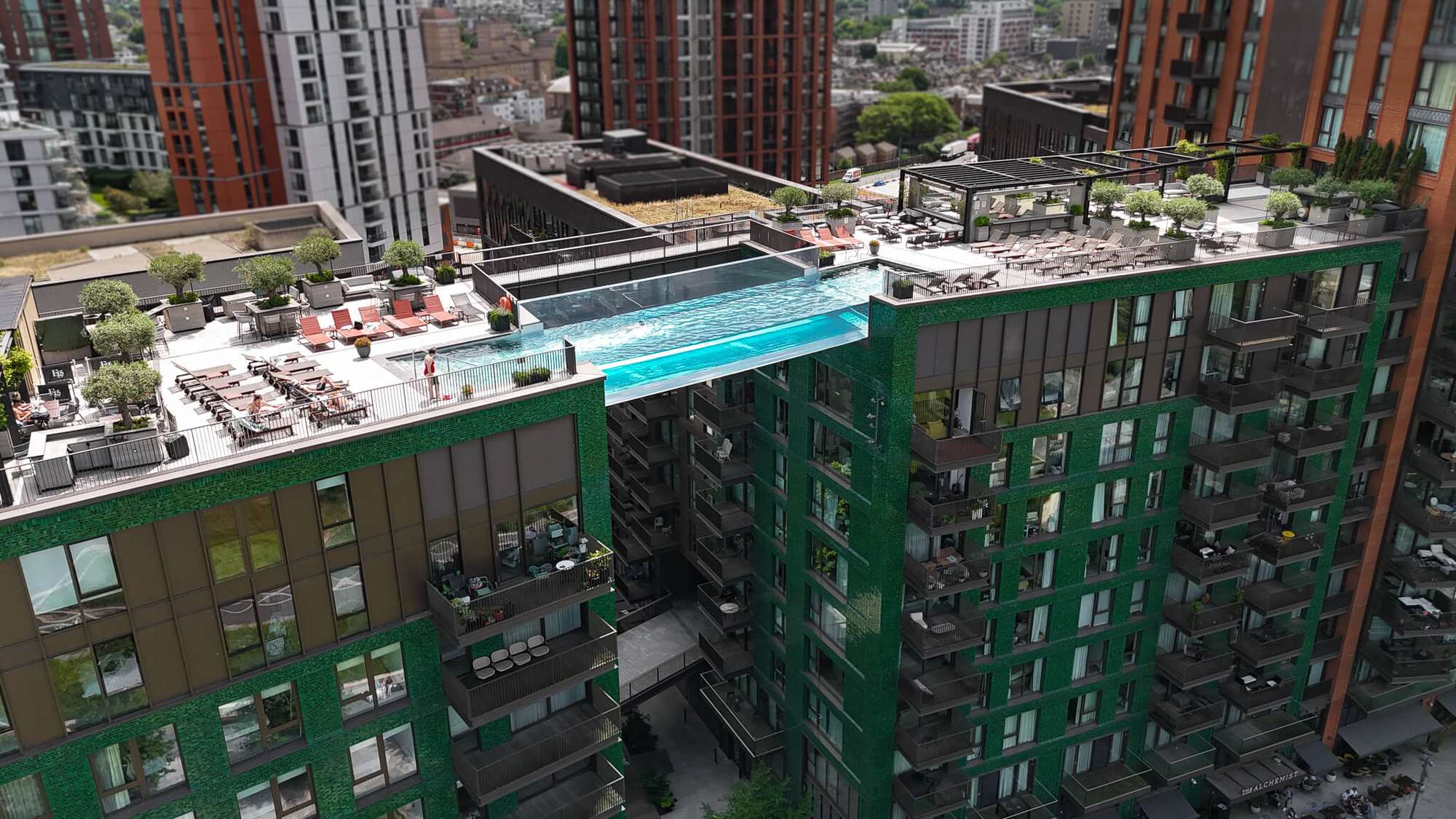 Aerial view of the Embassy Gardens sky pool suspended between two residential towers in London