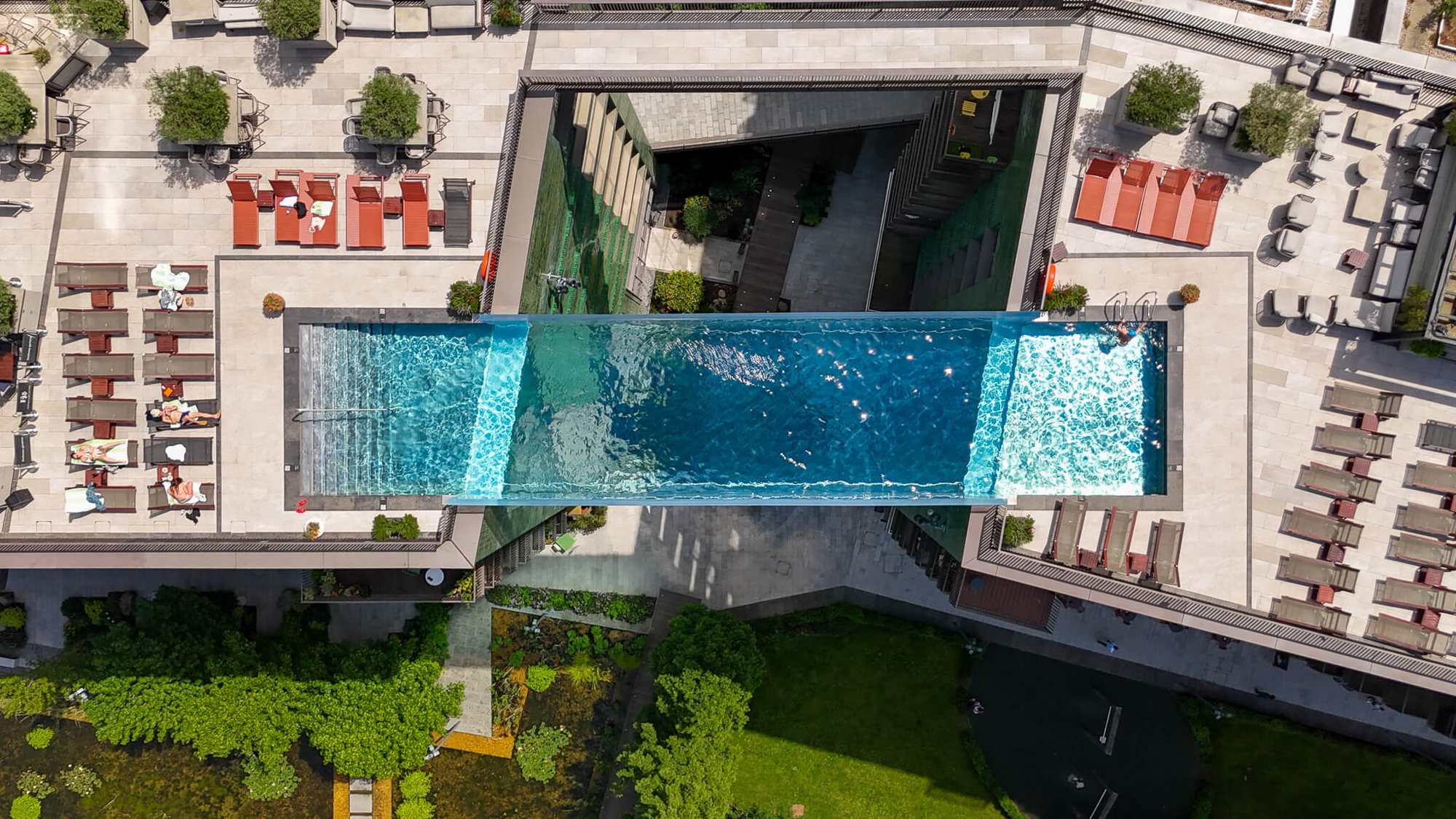 Top-down aerial view of the Embassy Gardens sky pool and rooftop terraces